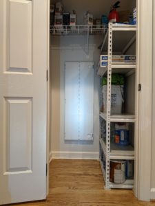 Closet networking cabinet with the door closed.