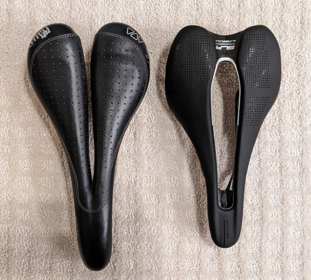 Photo of two Selle Italia bike saddles side by side, viewed from the top. An SLK Gel Flow with Vanox rails (on the left) and an SLR Boost Kit Carbonia Superflow size S3 (on the right).